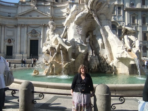 Judy in the Piazza Navona, in front of the "Fountain of the Four Rivers" by Bernini. 