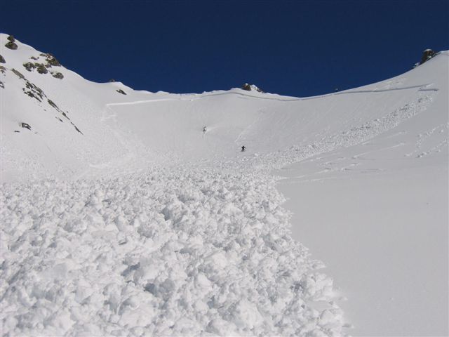 End of avalanche.
Part 2: The others in the party said I disappeared completely for the duration of my ride and miracle of miracle my hand broke through when it came to a stop.

Initially while my skis were attached I knew I was in big trouble crushed under the heavy snow and I thought I had stopped but it was just the skis dragging. They must have released because I took off again. Managed to get my arms out in front of me and "bodysurfed" until the avalanche terminated me face down