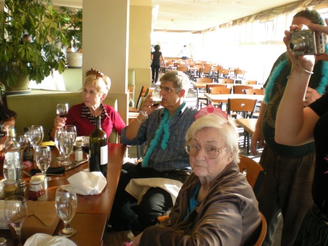 Kathy, Rob and Dorthea. (That's Keith on the right whose face is blocked by someone's camera).  Check out the empty tables in the background.  We sure know how to clear a room, don't we?