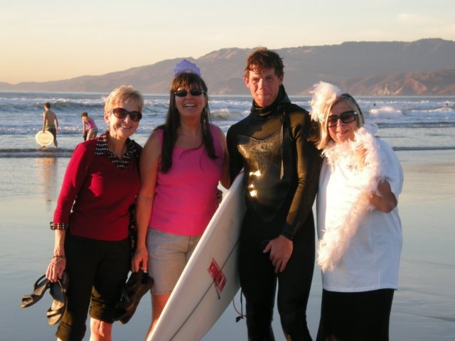 Kathy, Vici, Baron (the hunky surfer I grabbed as he walked by - actually chased down the beach for quite a ways - and me.  I know how to pick, em, eh?