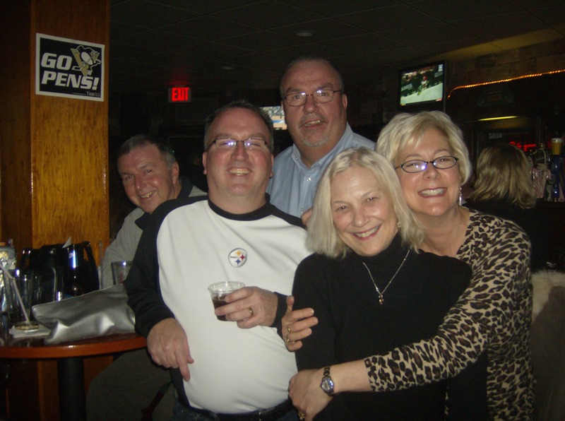 My nephew Corey joined the Navy, this was his going away party.  My hubbie Mark is in the white, I am huging my sister-in-law Vicki(Corey's mom). Her hubbie Bill (Mark's brother) is sitting down and other brother Brian is standing.  See the family resemblance?!  We all get along and want to hang out, even after all these years!