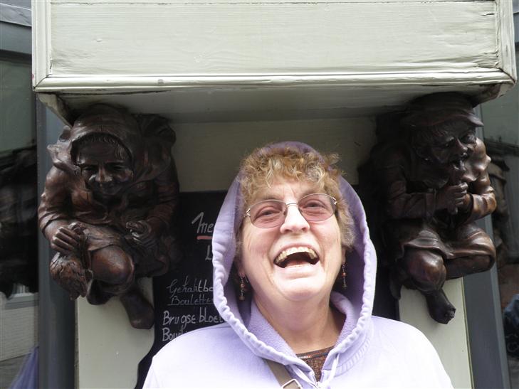 between these two statues, who were busy holding up a planter box.  Being winter, the box was empty.