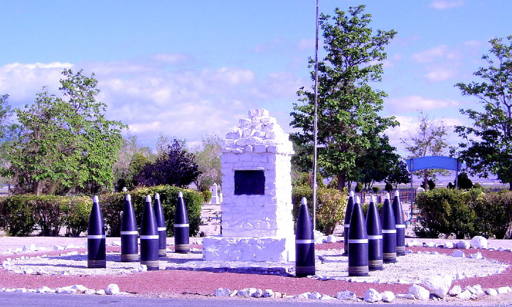 Bombs used as a memorial marker fence.