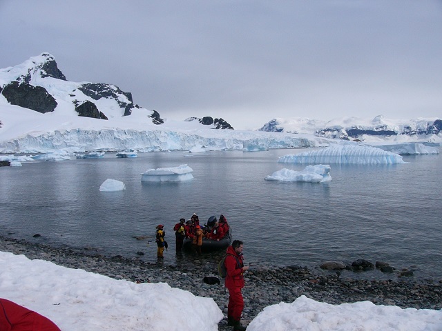 A group from our ship stepping ashore for the first time from their Zodiac.