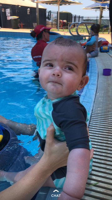 Having his swimming lessons at 7 months