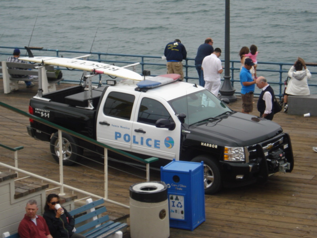 When we got to the end, look at what we found. This is the only cop car that I've ever seen with a surf board on the back.