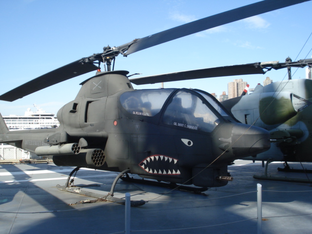 They have lots of aircraft on display along the ship's deck.