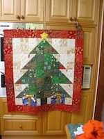 This is a quilt made by Mrs. Wombat.  The Christmas theme is obvious