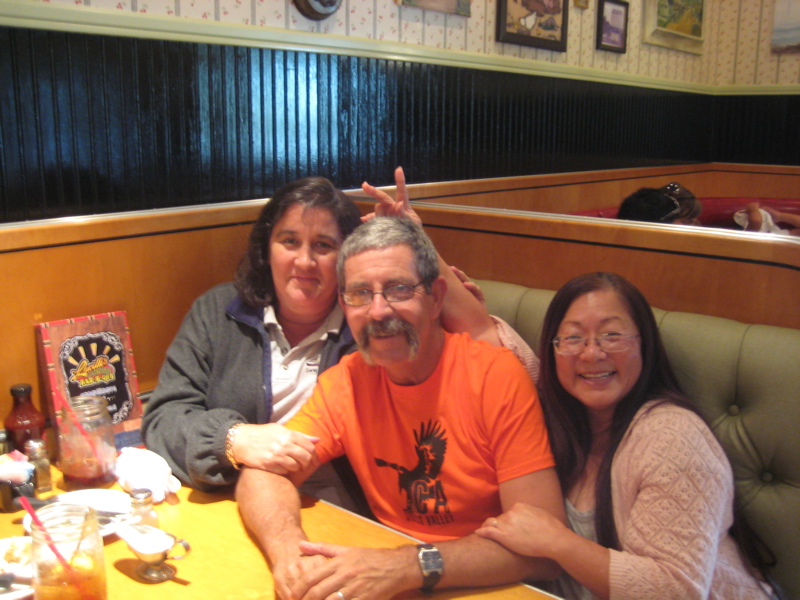 They took me out to dinner!  Note Kathi is helping me put bunny ears on Robert!