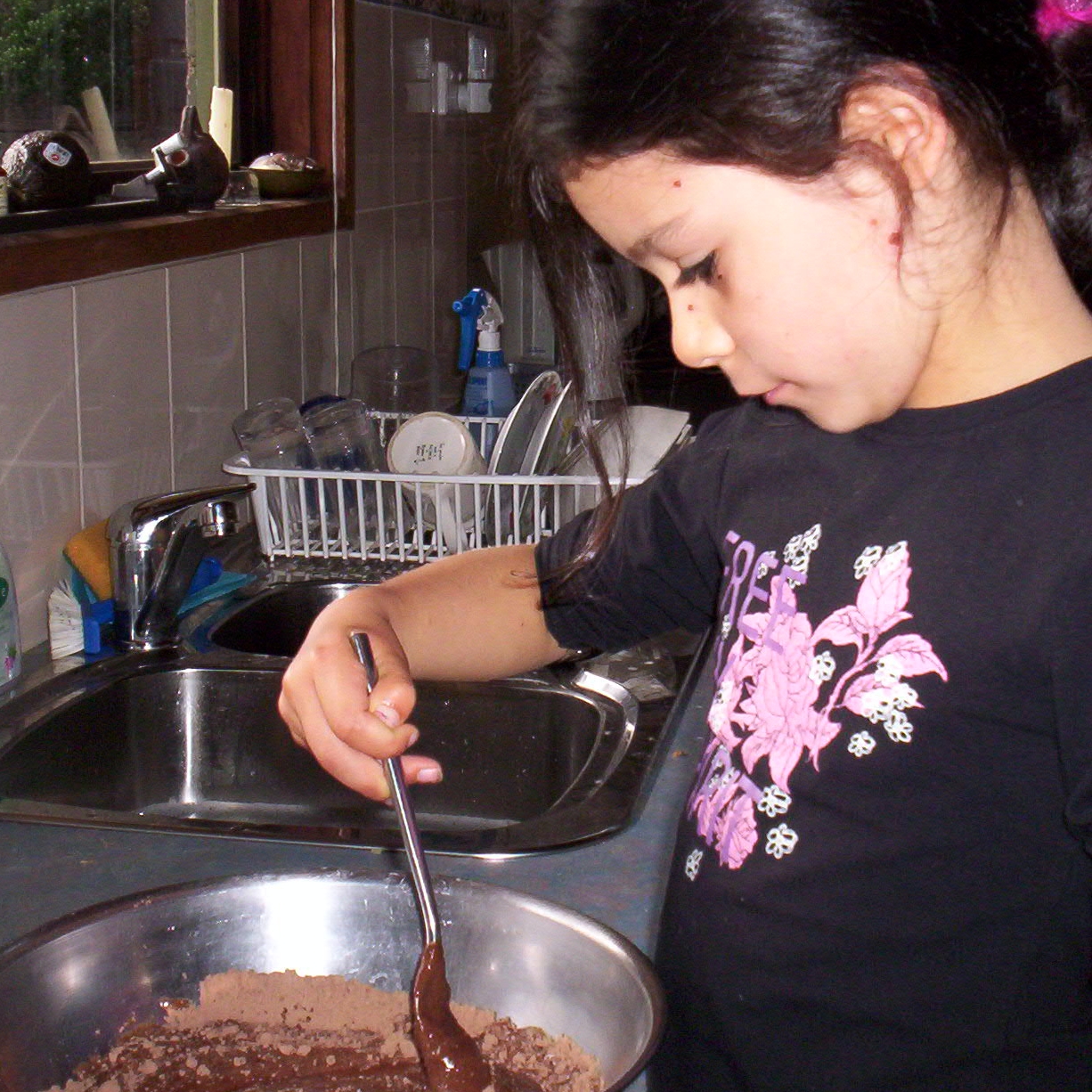 Lucy making her birthday cake