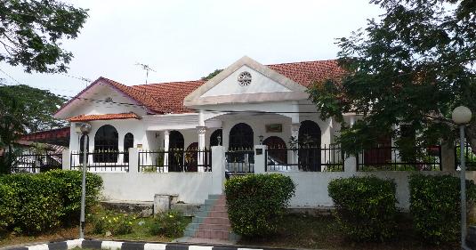 There is also a photo of an old style house that is next door to this new one.