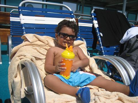 Kevin enjoying his drink on top deck swimming pool.