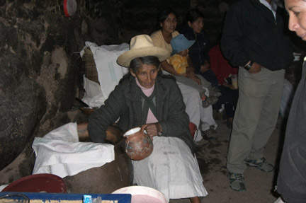 Inca bar owner serving her homemade corn beer