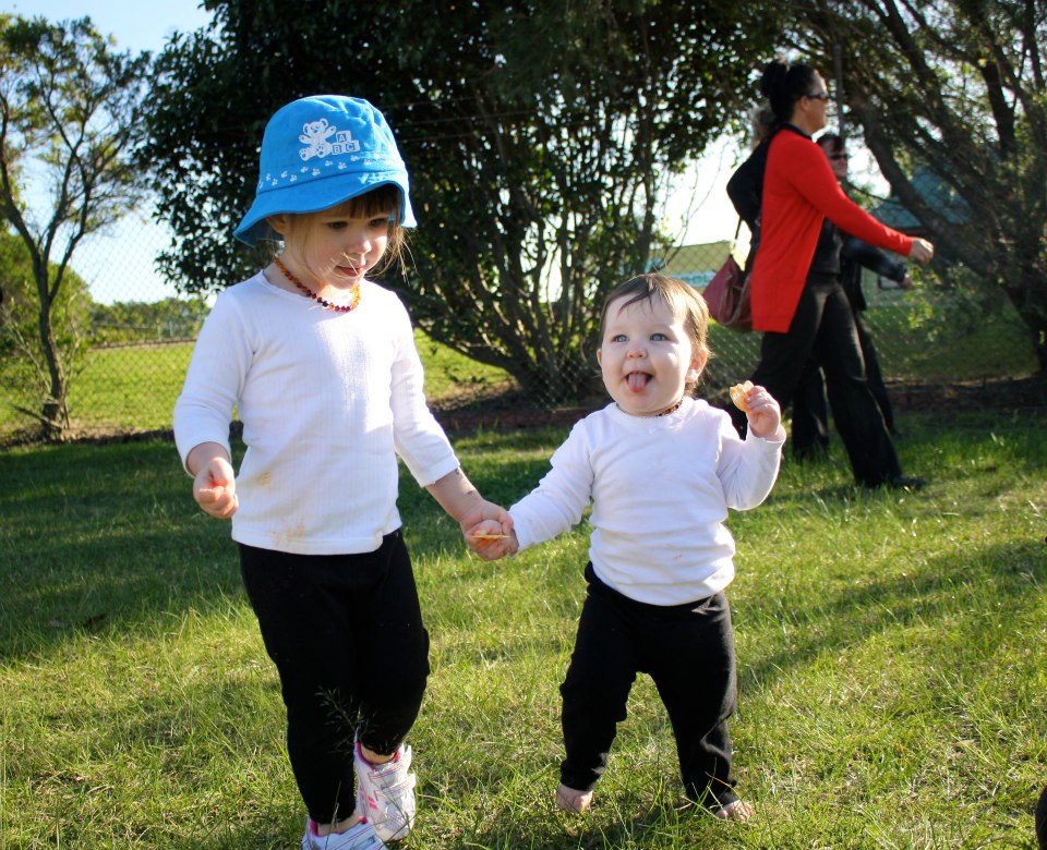 Cailin is still a bit wobbly on her feet, Ella likes helping.